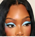 Vivid blue and black eye makeup with dramatic lashes