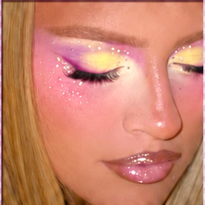 Creative pink, yellow and purple sunset eye makeup with sparkles